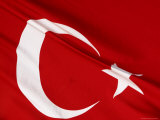 Close-up of the Flag of Turkey with a White Star and Moon on Red Fabric
