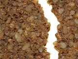 Close-up of a Rough Broken Granola Bar with Chunks of Grains
