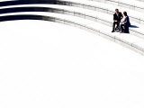 Business Man and Woman Sitting on Stairs