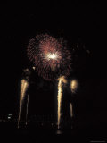 Bright and Colorful Fireworks Exploding in the Night Sky