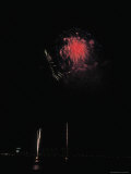 Bright and Colorful Fireworks Exploding in the Night Sky