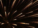 Bright Golden Fireworks Exploding in the Night Sky