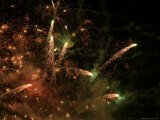 Bright and Colorful Fireworks Exploding in the Night Sky