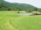 A Landscaped Golf Course with a Pond