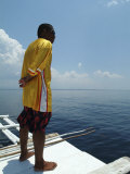 Man Standing on a Boat