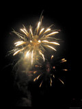 Bright Golden Fireworks in the Night Sky