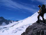 A Mountain Climber Stands on Emmons Glacier in the Mt Rainier National Park  Washington  USA