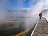 People Walking Boardwalk Over Hot Springs of Black Sand Basin  Yellowstone Nat Park  Wyoming  USA