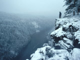 Man on a Cliff Looking Down at a River