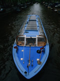 Blue Canal Tour Boat on Canal  Amsterdam  North Holland  Netherlands