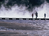 Tourists Silhouetted Against Steam from Grand Prismatic Spring  Yellowstone National Park  USA