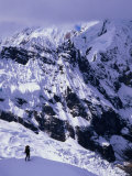 Climber Ascending to Alpamayo High Camp with the Slopes of Pucahirca Massif Beyond  Ancash  Peru
