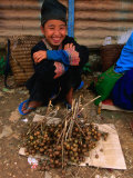 White Hmong Girl with Dried Berries  Looking at Camera  Laos