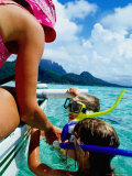 Children Snorkelling from Motor Boat  French Polynesia