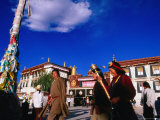Tibetans Walking Around Jokhang Temple Spinning Prayer Wheels in Barkhor Square  Lhasa  China