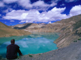 Traveller Sitting Overlooking the Turquoise Yamdrok Tso (Lake) on the Friendship Highway  China