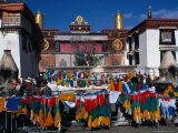 Colourful Prayer Flags in Square Outside Traditional Building  Lhasa  Tibet