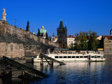 Passenger Ferry Cruising Up Vltava River Near Charles Bridge  Prague  Czech Republic