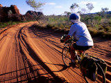 Cyclist on Outback Road  Purnululu National Park  Australia