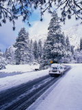 A Laden Car on Snowy Winter Roads  Yosemite National Park  California  USA