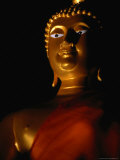 Illuminated Statue of Orange-Robed Buddha  Thailand