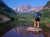 Hiker Stands on a Rockoverlooking Maroon Bells  Aspen  Colorado  USA