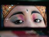A Young Legong Dancer Checks Her Make-Up in a Compact Mirror  Ubud  Indonesia