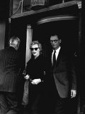 Marilyn Monroe and Husband Arthur Miller Leave Their London Hotel  July 1956