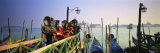 Gondolas and People in Carnival Costumes  Piazza San Marco  Venice  Italy
