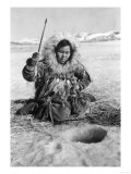 Eskimo Woman Fishing through Ice in Alaska Photograph - Alaska