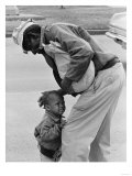 African American Man Comforts Crying Child Photograph