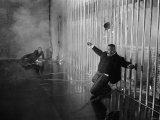 Sean Connery as James Bond 007 Electrocutes Goldfinger's Henchman Odd Job in the Vault