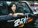 Singer Amy Winehouse Poses in a Brits Sponsored Mini Car