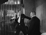 Sean Connery as James Bond 007 Electrocutes Goldfinger's Henchman Odd Job in the Vault