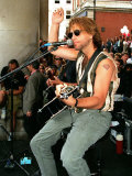 Pop Star Jon Bon Jovi Busking in Covent Garden to the Crowds Playing Guitar and Singing Into Mike