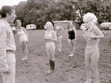 Barbara Windsor Covers Her Breasts with Her Hands After Losing Her Bikini Top