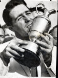 Golfer Gary Player Celebrates Winning the Open Golf Championship by Kissing Trophy