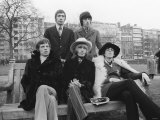 Rolling Stones Sitting on Bench in Park