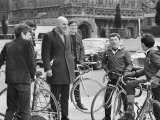 Actor Telly Savalas  Surrounded by Young Fans During a Walk in London with His Wife
