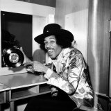 American Musician Jimi Hendrix in Dressing Room Holding a Copy of Single  Earing a Black Hat