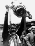 Liverpool Player Manager Kenny Dalglish Holding the Trophy After Their Win Against Everton