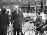 Actor Telly Savalas  Surrounded by Young Fans During a Walk in London with His Wife