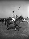 Prince Philips Rides Along on Horseback Holding Polo Stick During Game