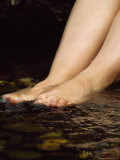 Pregnant Lady Cools Her Feet in a Rainforest Stream