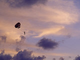 Para Sailing Over Patong Beach at Sunset Under Brilliant Storm Clouds