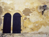 Paint Peeling Off an Antique Wall and Shuttered Windows and a Lantern