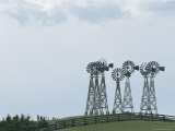 Cluster of Windmills Rises Over the Rolling Countryside