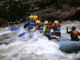 Rafters Riding the Rock Strewn Gauley River Through a Mountain Gorge