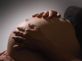 Pregnant Woman Strokes Her Baby Through Her Belly