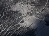 Snow and Glacial Ridges Along the Cracked Surface of the Andes